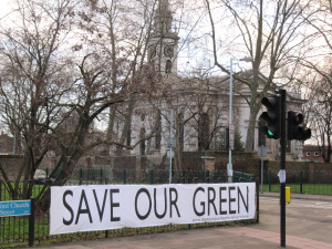 Banner 'Save our green' attached to fence at Deptford Church Street/Coffey Street
